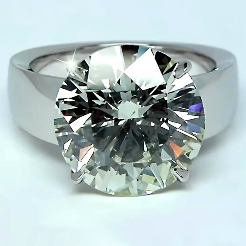 Sterling silver 5 carat genuine Moissanite engagement ring.